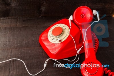 Old Landline Headphones Listening Through A Modern White Headpho… Stock Photo