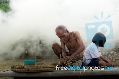 Old Man And Girls On Litter Stock Photo