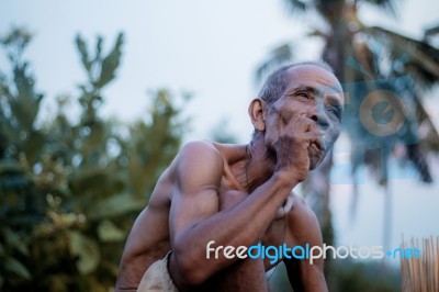 Old Man Are Smoking Cigarettes Stock Photo