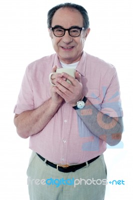 Old Man Holding Coffee Mug Stock Photo