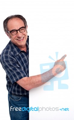 Old Man Pointing At Blank Board Stock Photo