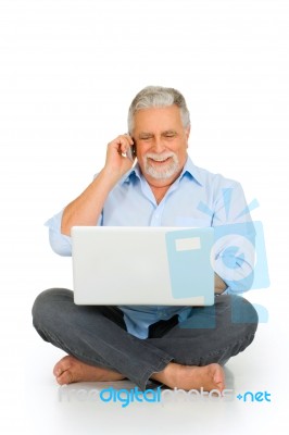 Old Man With Laptop Mobile Phone Stock Photo