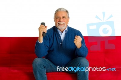 Old Man With Romote Control Stock Photo