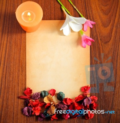 Old Paper With Flowers And Candle Stock Photo