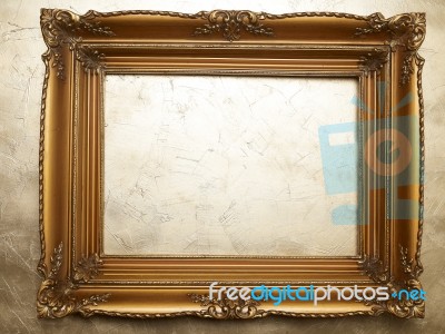 Old Picture Frame On Gold Wall Stock Photo