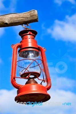 Old Red Lantern On Blue Sky Stock Photo