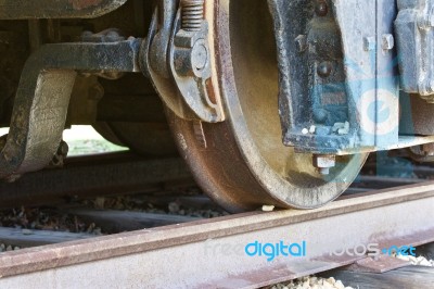 Old Rusty Wheels Of A Train And The Railway Stock Photo