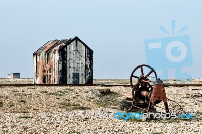 Old Shack And Rusty Machinery On Dungeness Beach Stock Photo