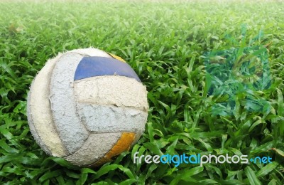 Old Soccer Ball On Green Grass Stock Photo