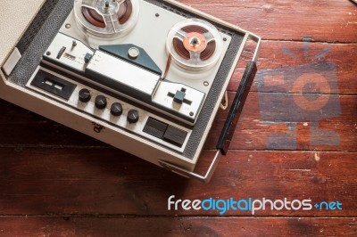 Old Tape Recorder On Wooden Background Stock Photo