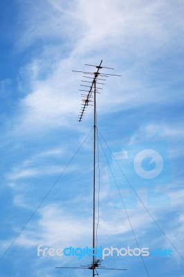 Old Television Antenna Against Blue Colorful Sky Stock Photo