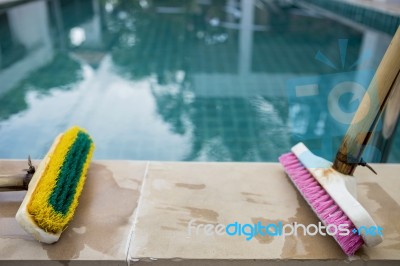 Old Two Plastic Brush On Poolside Stock Photo