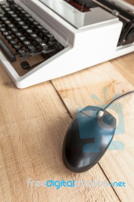 Old Typewriter Connected To A Computer Mouse Stock Photo