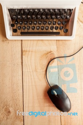 Old Typewriter Connected To A Computer Mouse Stock Photo