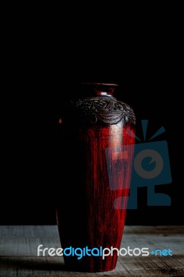 Old Vase On A Wooden Stock Photo