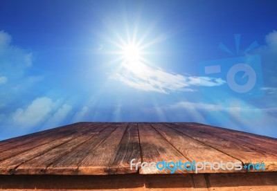 Old Wood Table And Sun Shine On Blue Sky Stock Photo