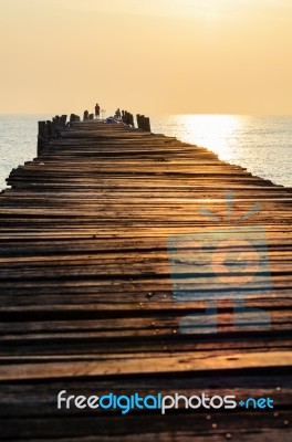 Old Wooden Pier At Sunrise Stock Photo