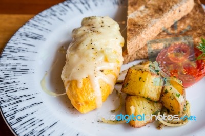 Omelet With Potato, Tomatoes Parsley And Feta Cheese And Bread In White Plate On Wooden Table Stock Photo