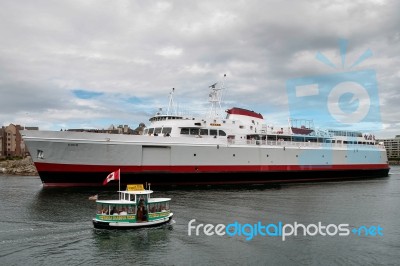 One Of The Many Victoria Habour Ferries Pottering Along In Vict Stock Photo