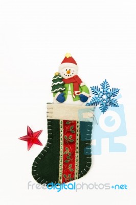 One Snow Man In The Green Christmas Sock Stock Photo