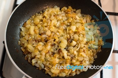 Onion Frying In A Pan Stock Photo