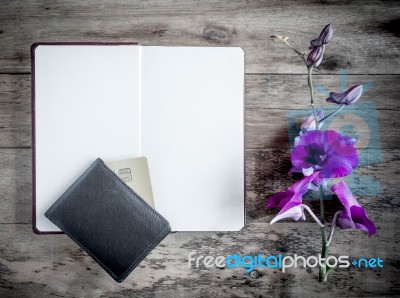 Open Book With A Purse And Credit Cards On A Wooden Background Stock Photo