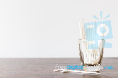 Oral Device : Dental Floss In Glass On Wooden Background Stock Photo