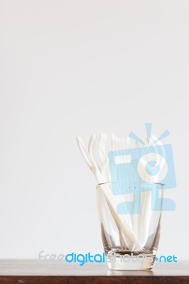 Oral Device : Dental Floss In Glass On Wooden Background Stock Photo