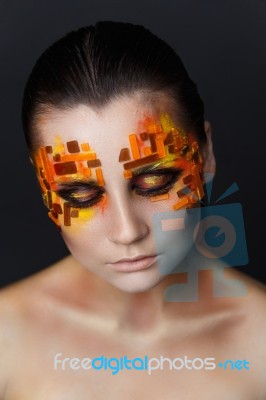 Orange And Red Rhinestones On A Girl Face Stock Photo