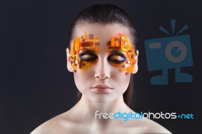 Orange And Red Rhinestones On A Girl Face Stock Photo