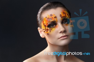 Orange And Red Rhinestones On A Girl Face Stock Photo