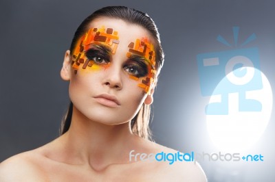 Orange And Red Rhinestones On A Girl Face Stock Photo