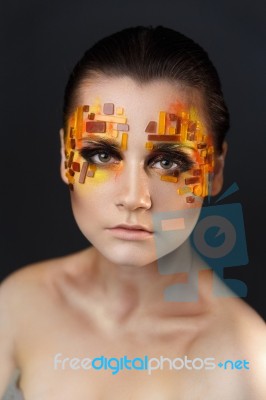 Orange And Red Rhinestones On A Girl Face Stock Photo