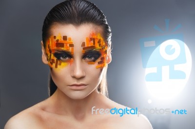 Orange And Red Rhinestones On A Girl Face Stock Photo