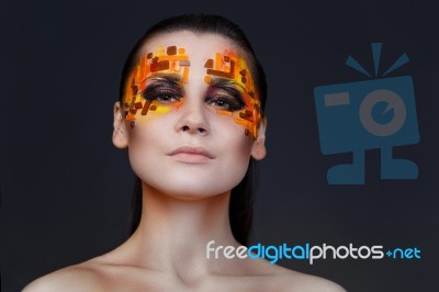 Orange And Red Rhinestones On A Girl Face Stock Photo