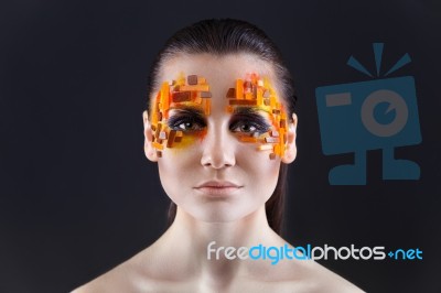 Orange And Red Rhinestones On A Girl Face Stock Photo