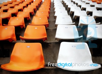 Orange And White Stadium Seats Stock Photo