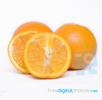 Orange Fruit Cut Into Two Pieces Stock Photo