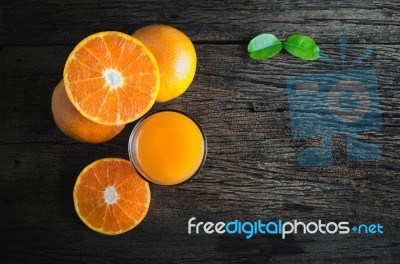 Orange Juice From Above On Wood Table Stock Photo