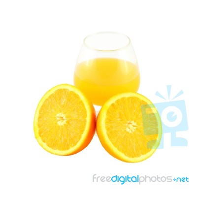 Orange Juice In Glass And Two Half Fruit Stock Photo