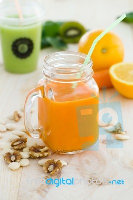 Orange Juice In Glass, Nuts And Fresh Fruits On Wooden Backgroun… Stock Photo