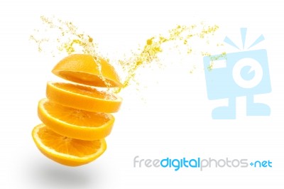 Orange Juice Splashing On White Background Stock Photo