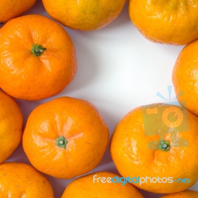 Orange On White Table Stock Photo