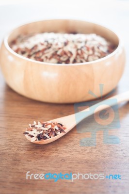 Organic Dry Multi Grain Rice In Wooden Bowl Stock Photo