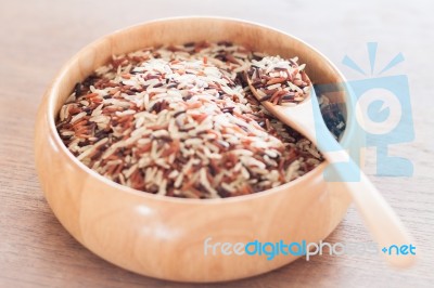 Organic Dry Multi Grain Rice In Wooden Bowl Stock Photo