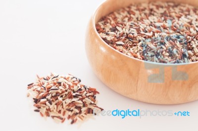 Organic Dry Multi Grain Rice In Wooden Bowl Stock Photo