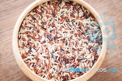 Organic Dry Multi Grain Rice In Wooden Bowl Stock Photo