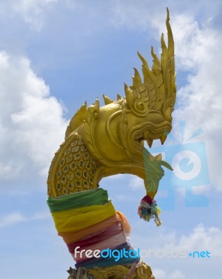 Oriental Yellow Dragon In Thailand Stock Photo