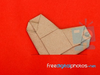 Origami Recycle Paper Heart On Red Paper Stock Photo