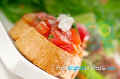 Original Italian Fresh Bruschetta Served With Fresh Salad And Ve… Stock Photo